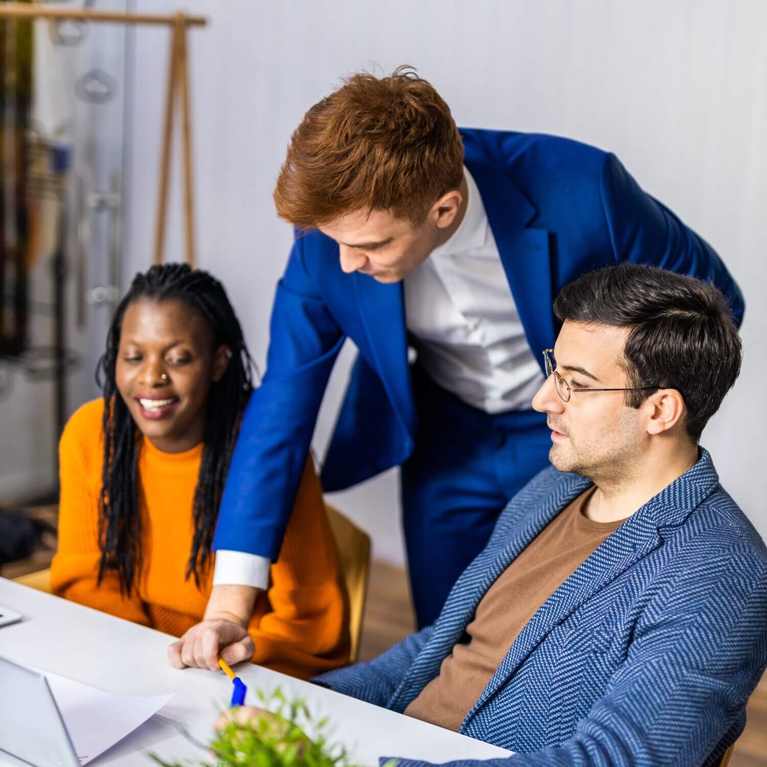 Project managers and employees brainstorming on ideas - Multi-ethnic group of workers having business meeting in a start-up office